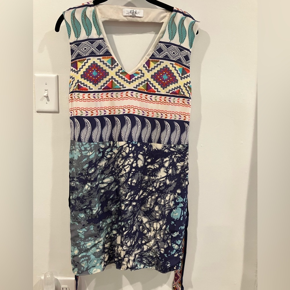 Mini v-neck dress: silk w/polyester lining. Keyhole back detail. Multi color